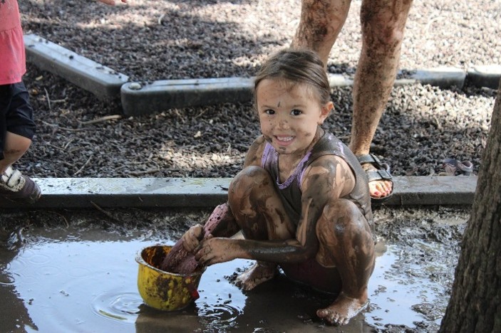 Child playing with mud play