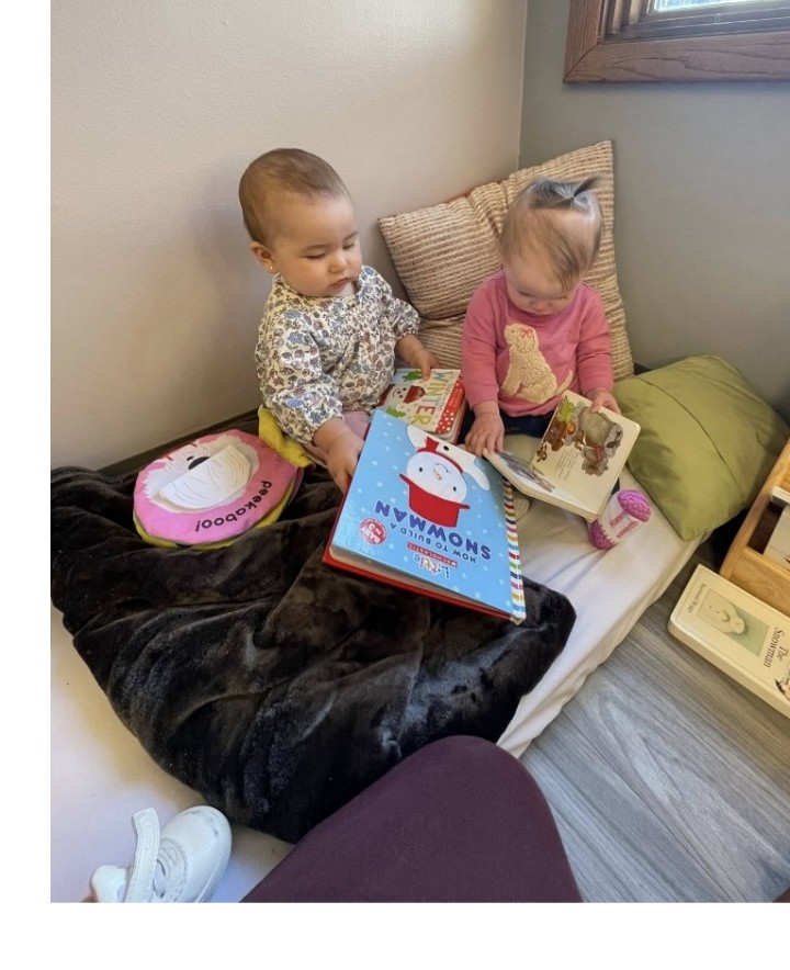 child looking at a book