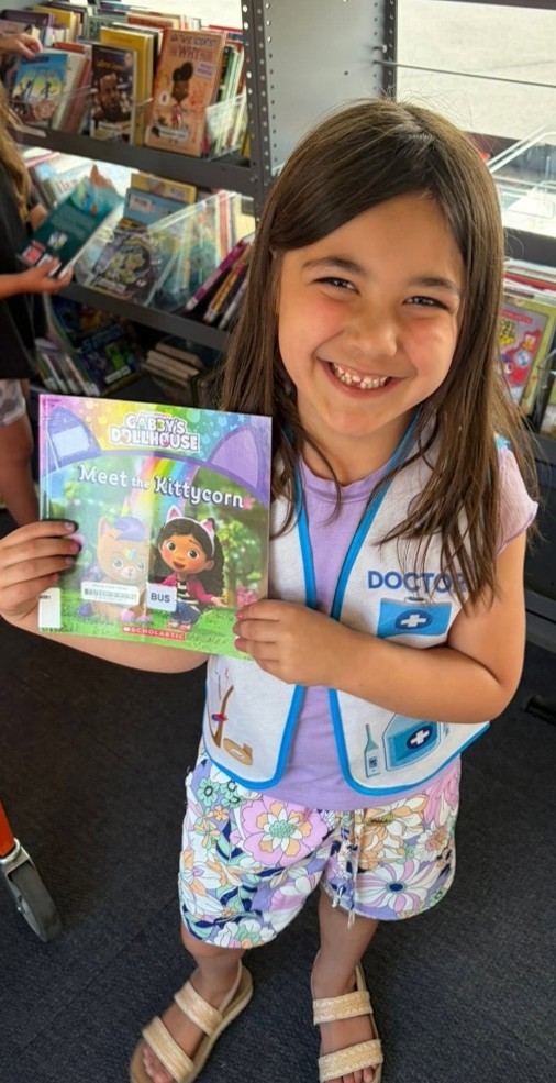 child showing a book