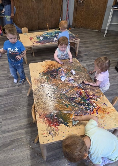 Children playing with finger paints