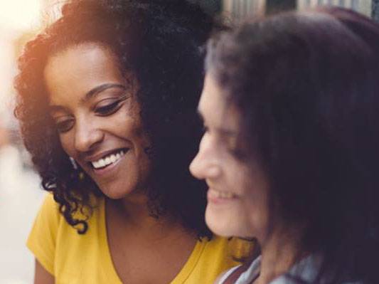 Image of two women talking