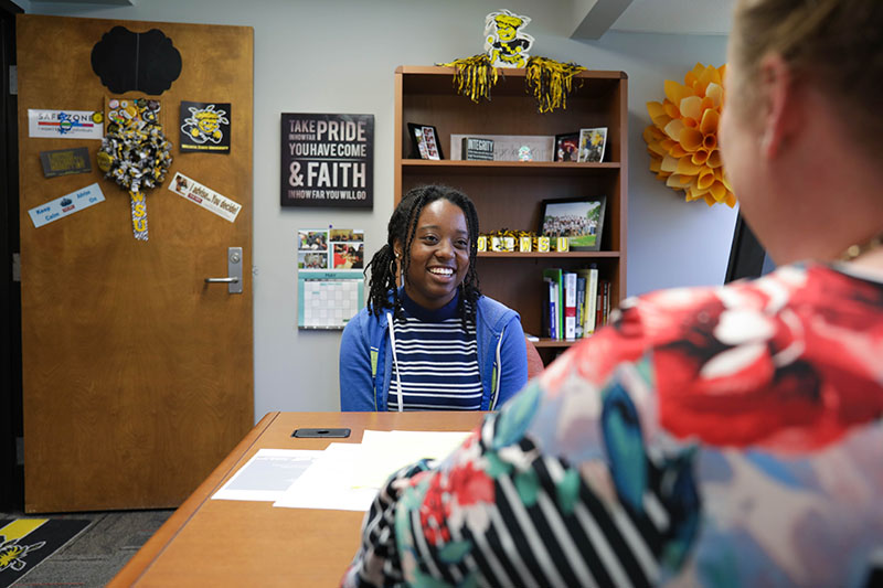 Student speaking with an academic advisor