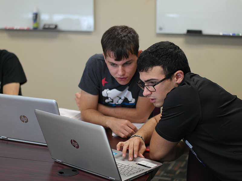 Students studying together in the conference room.