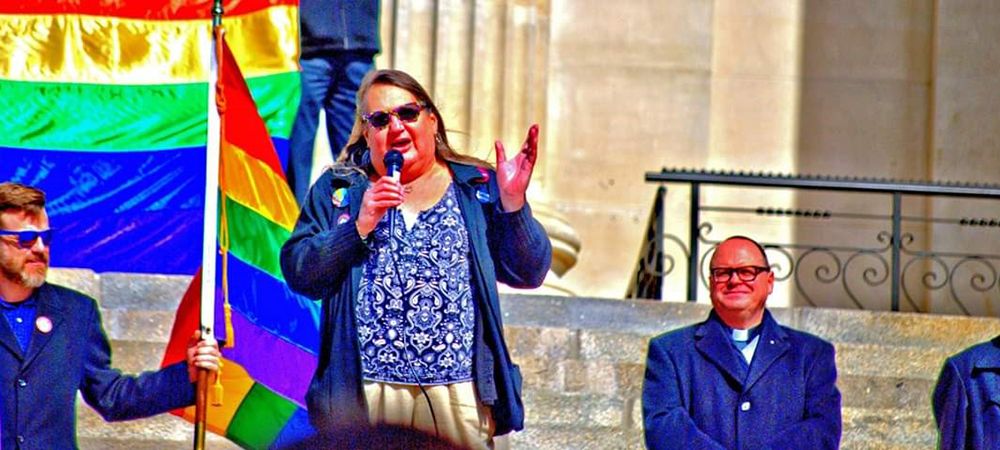 Stephanie Mott speaking at an LGBTQ+ rally.