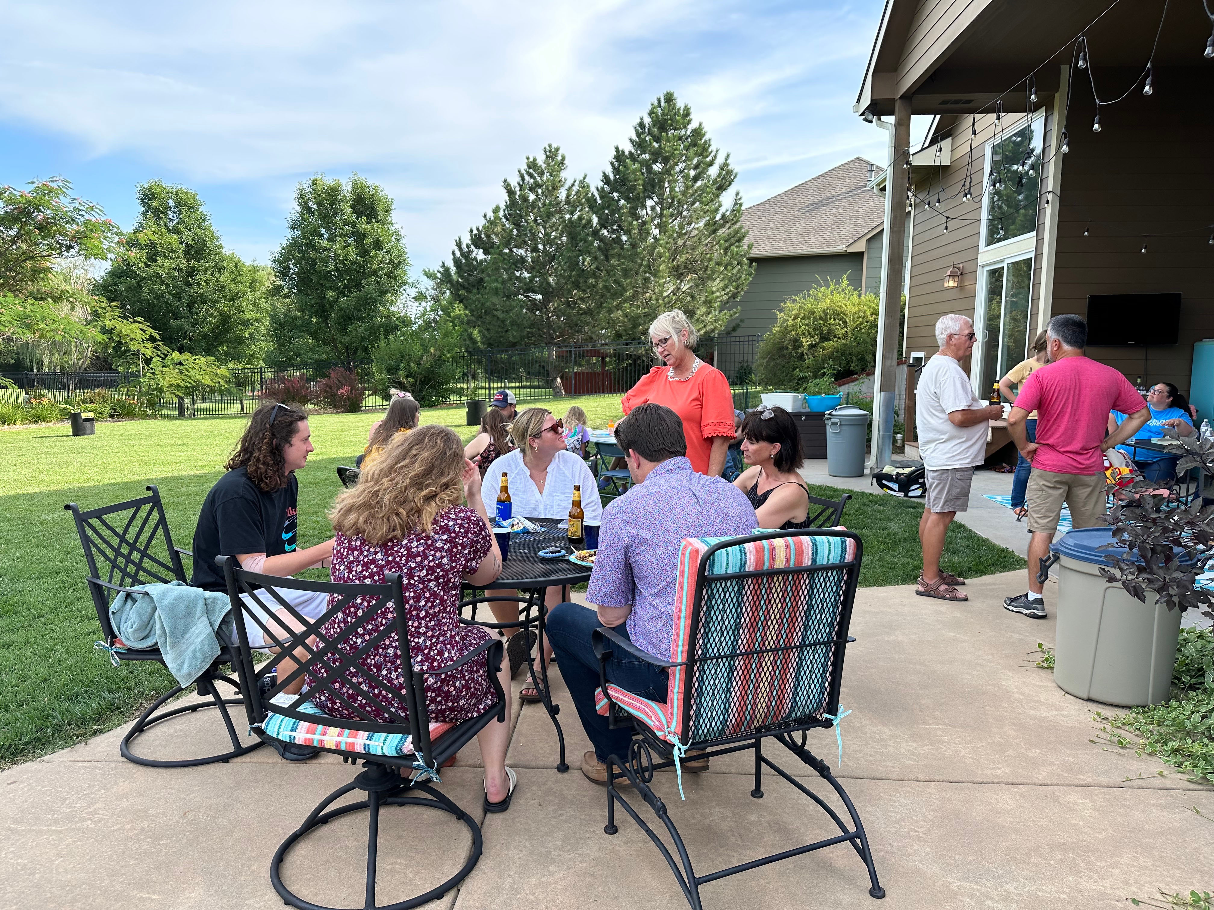 group sitting around a table outside