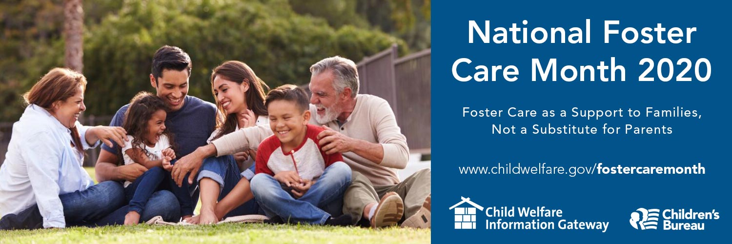 Foster care family on the grass. 
