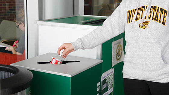 A student recycles at the RSC