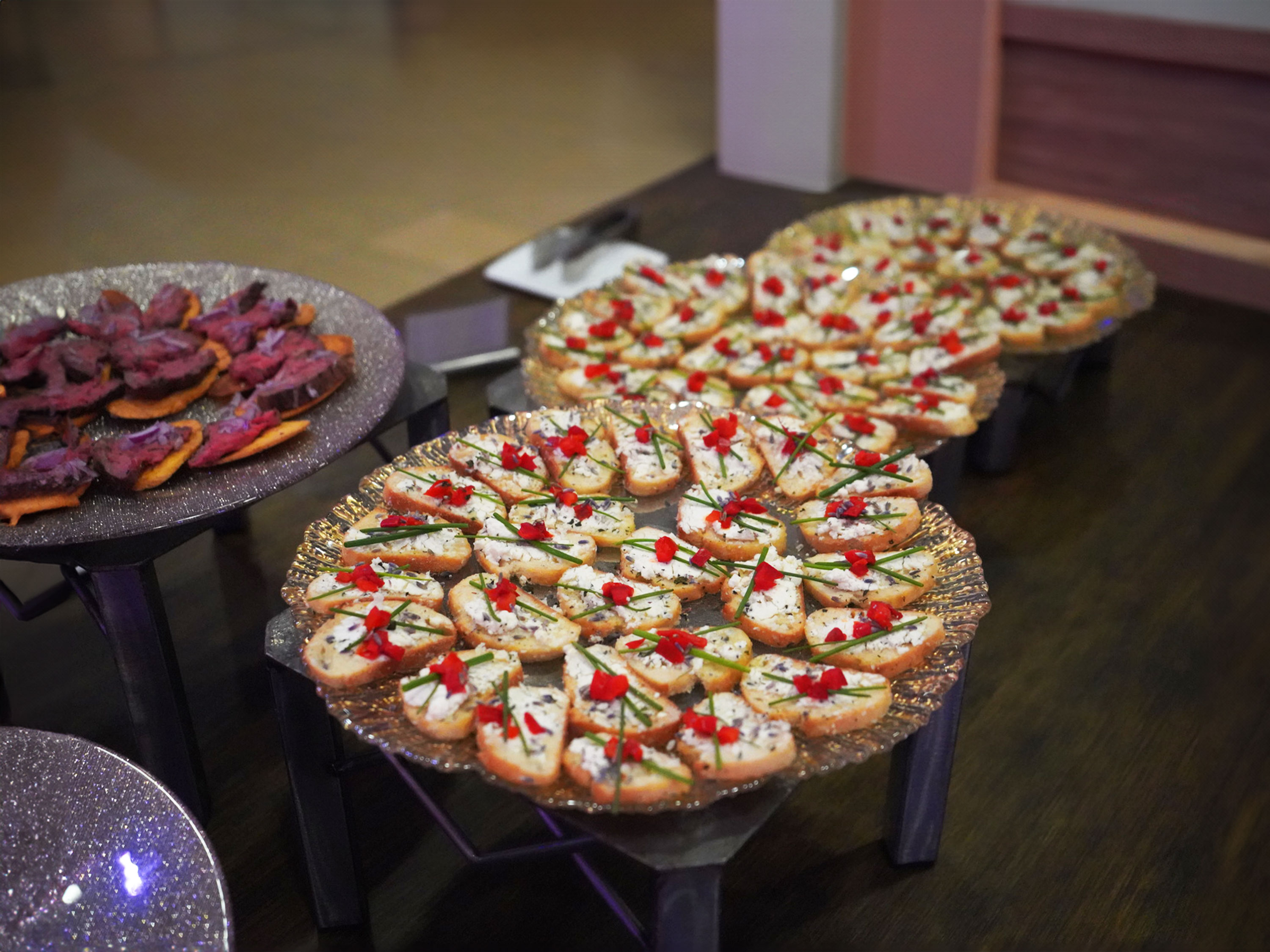 Goat cheese, garlic and herb crostinis on a display plate.