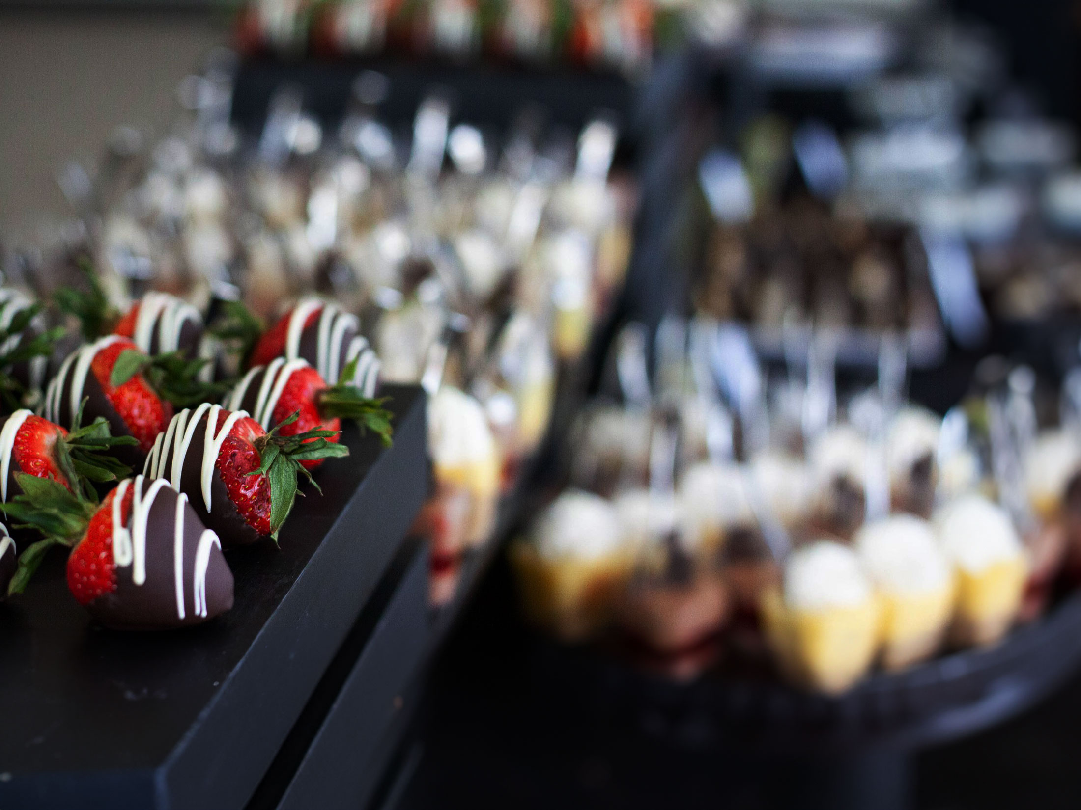 Chocolate-covered strawberries on a display.