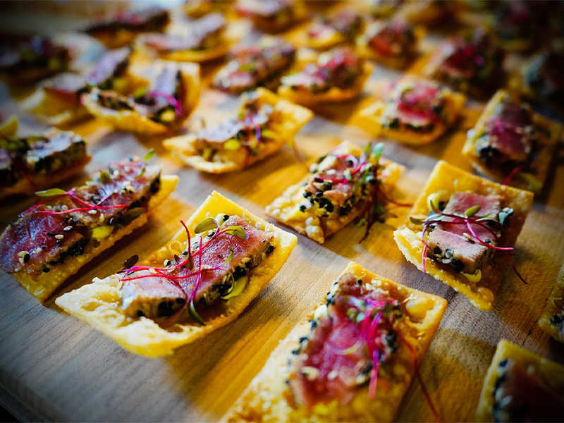 Bite-sized steak on a crisp chip.