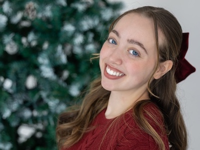 Lylah Covey with a Christmas tree