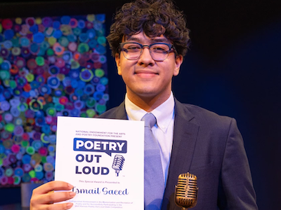 Ismail Saeed is holding a poetry award