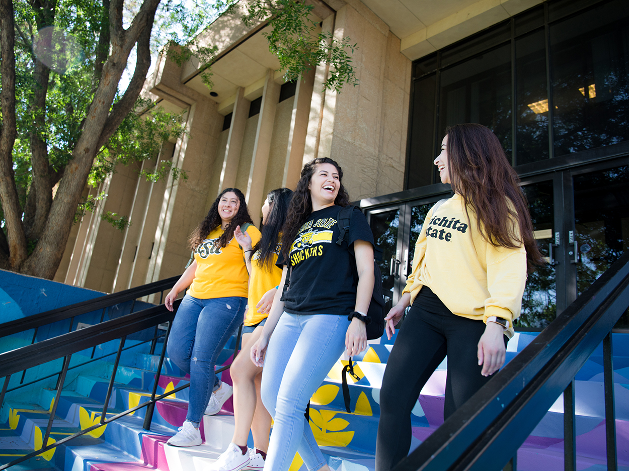 Students on the stairs at Clinton Hall