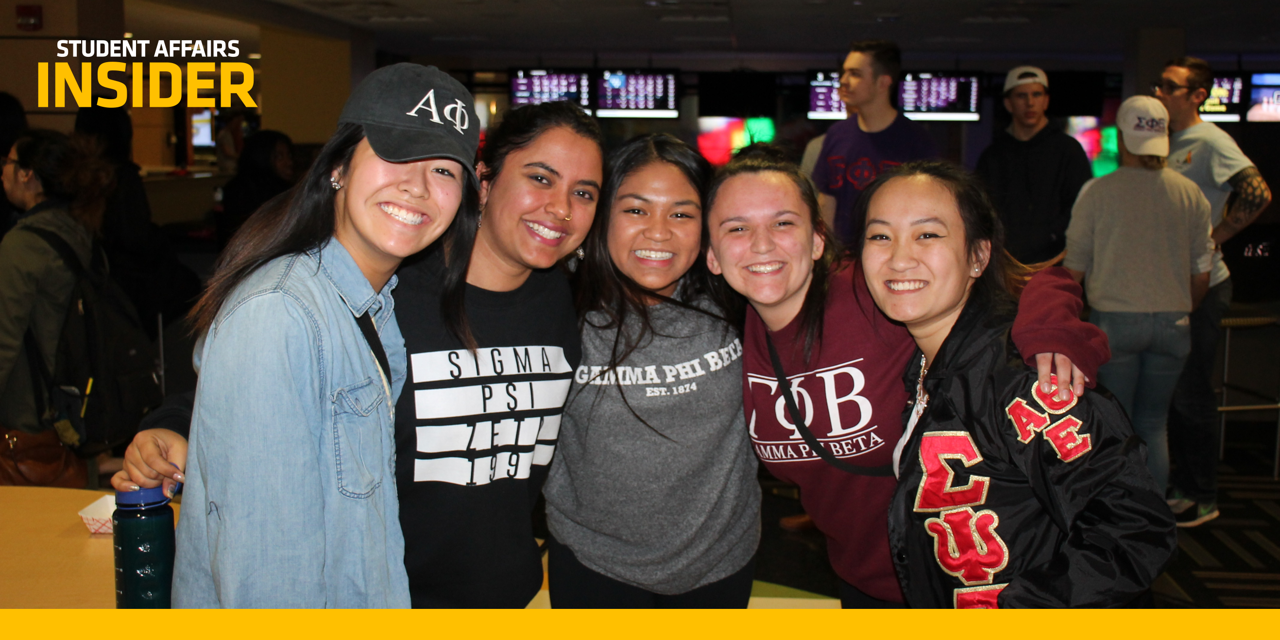 Greek Life students smiling at Shocker Sports Grill & Lanes