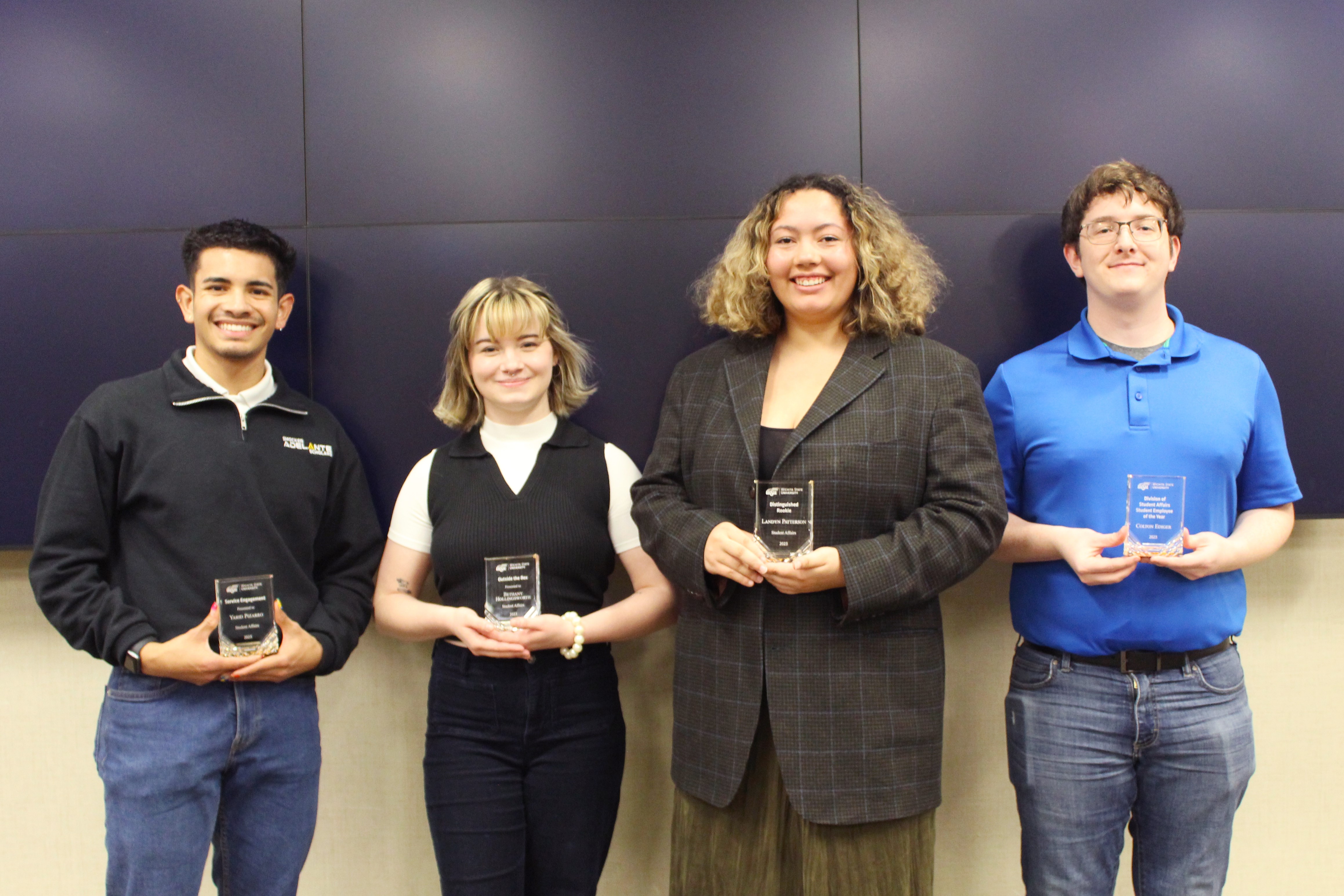 award winners with trophies