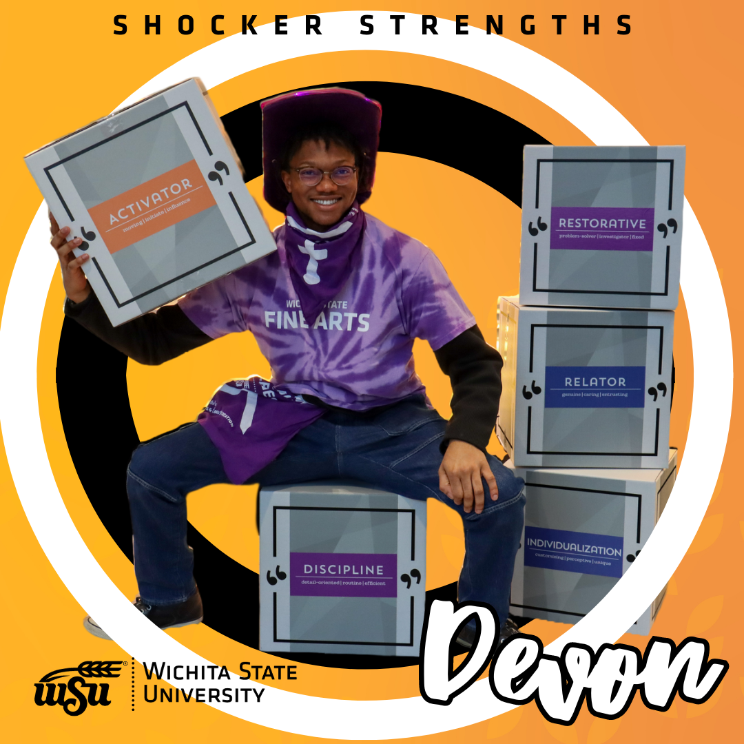 boy standing next to strengths boxes