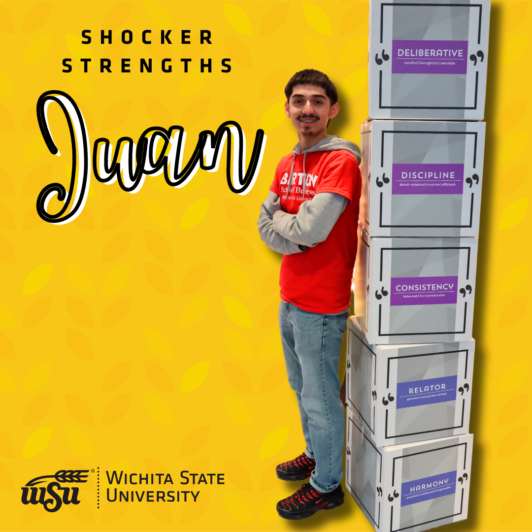 boy standing next to boxes
