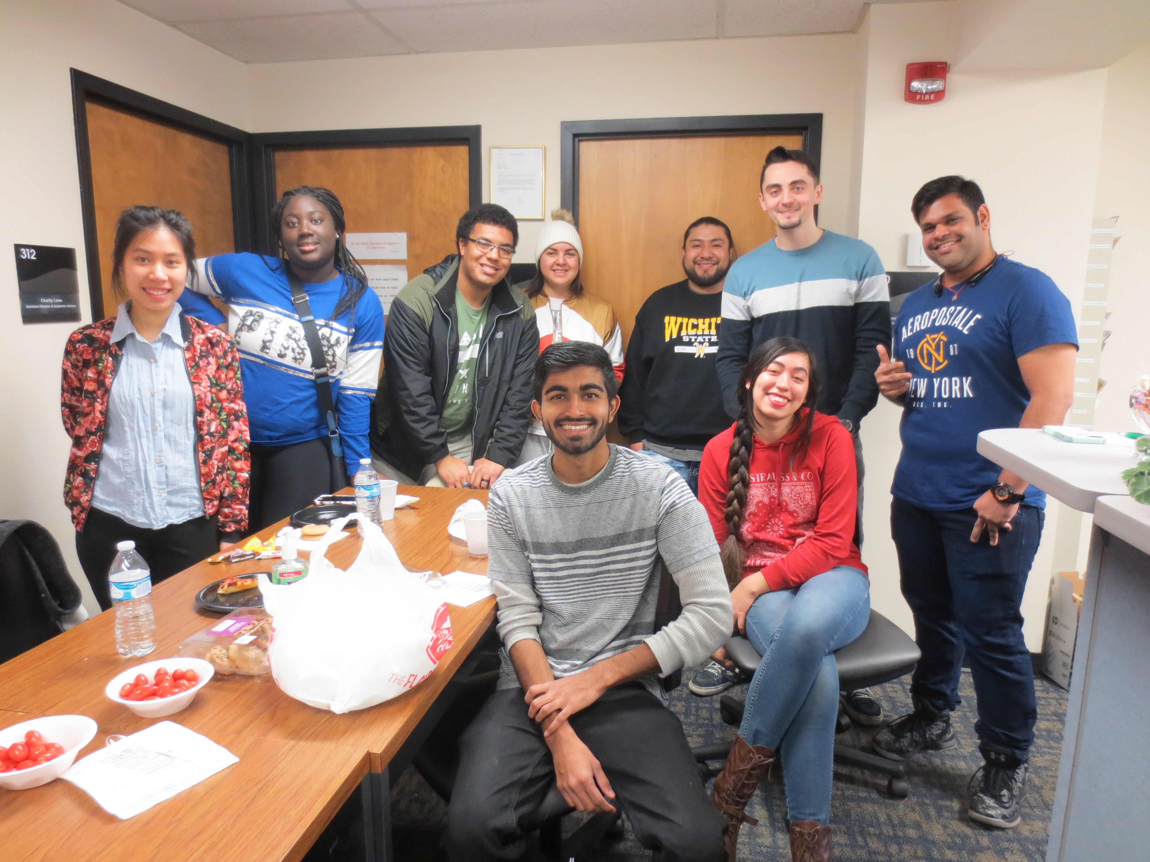 group photo of students in break room