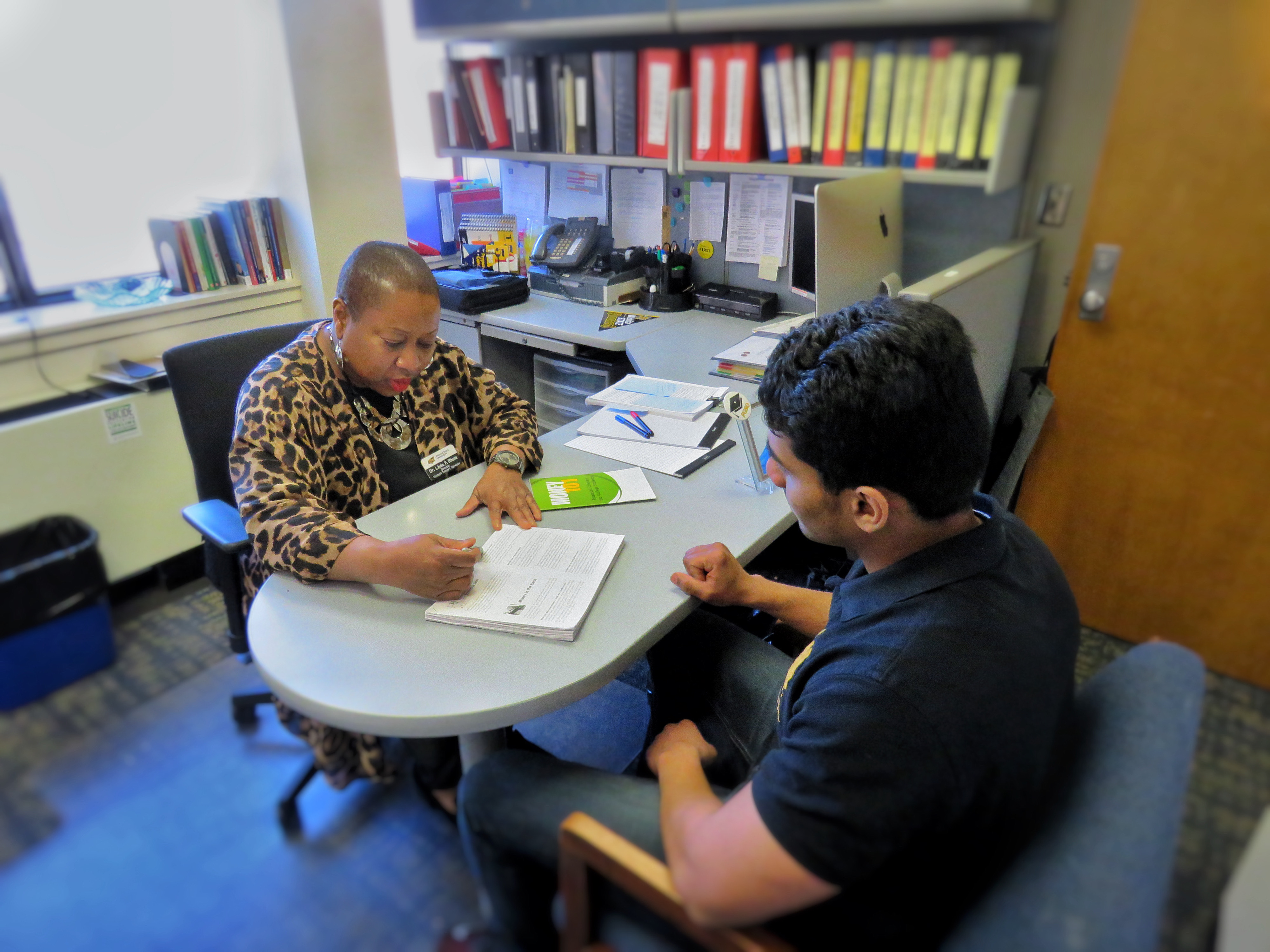 The director working with a student