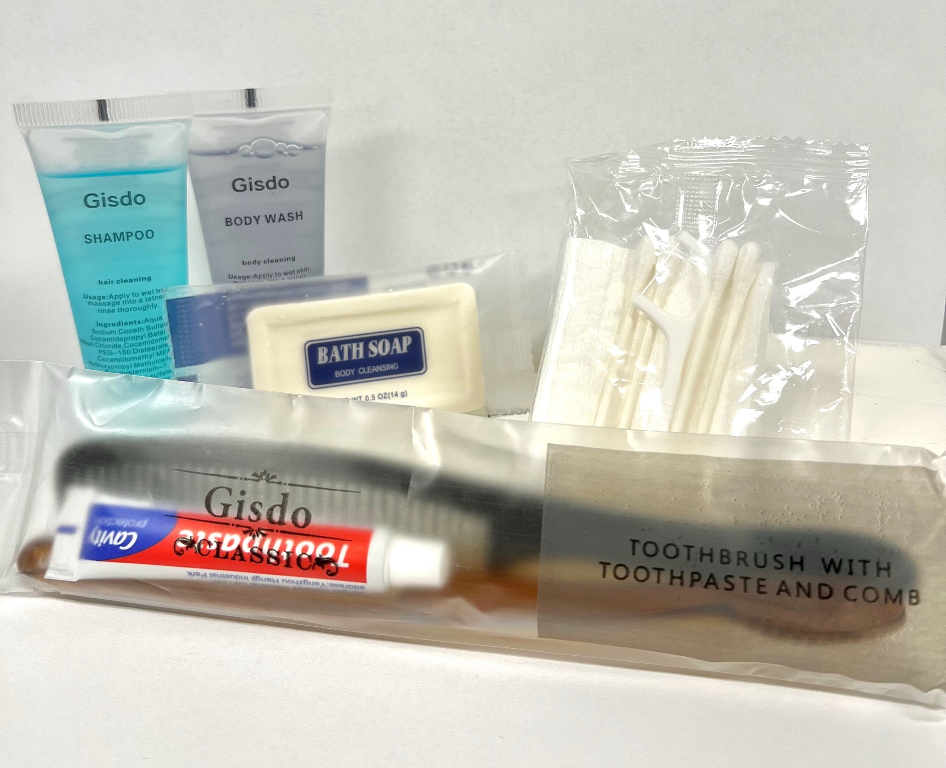 tooth brush, shampoo, body wash, bar soap, q-tips, flosser, comb, washing cloth