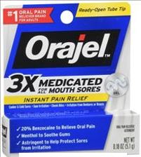 Blue and white box indicating Orajel which is used for reducing pain or irritation of mouth and gums