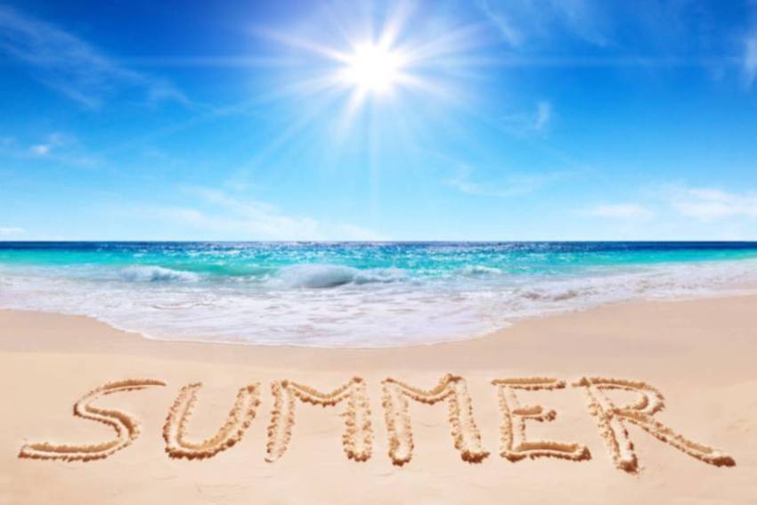 beach with summer written in the sand