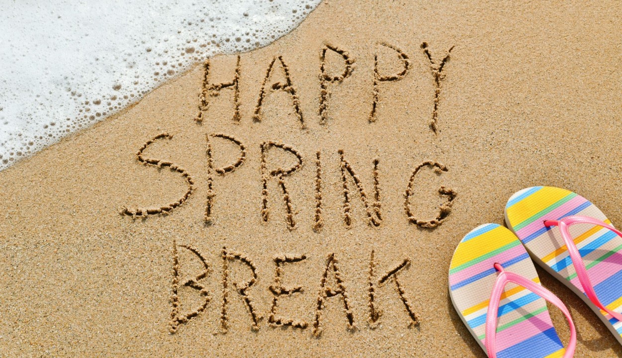 Spring Break on a beach with the sand outlining the words spring break