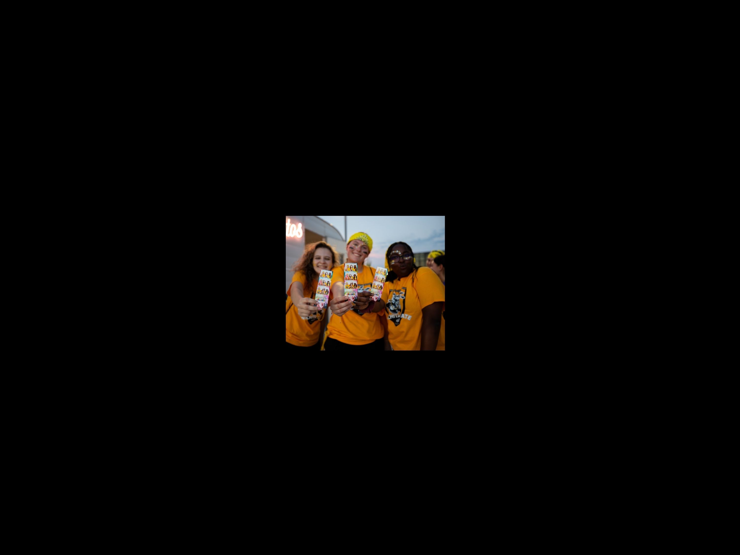 students posing with clash photobooth picture
