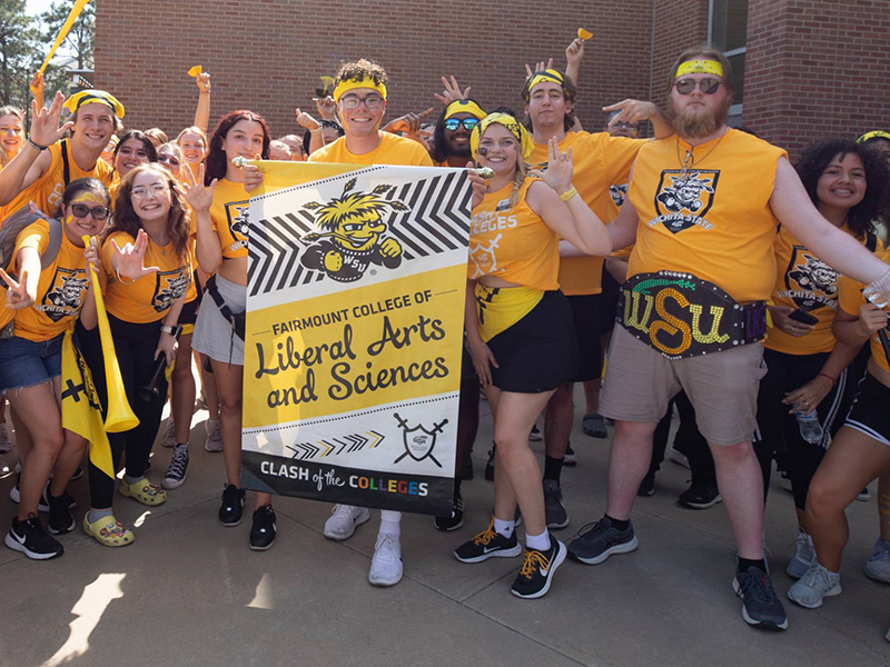 Students with their college banner at Clash of the Colleges