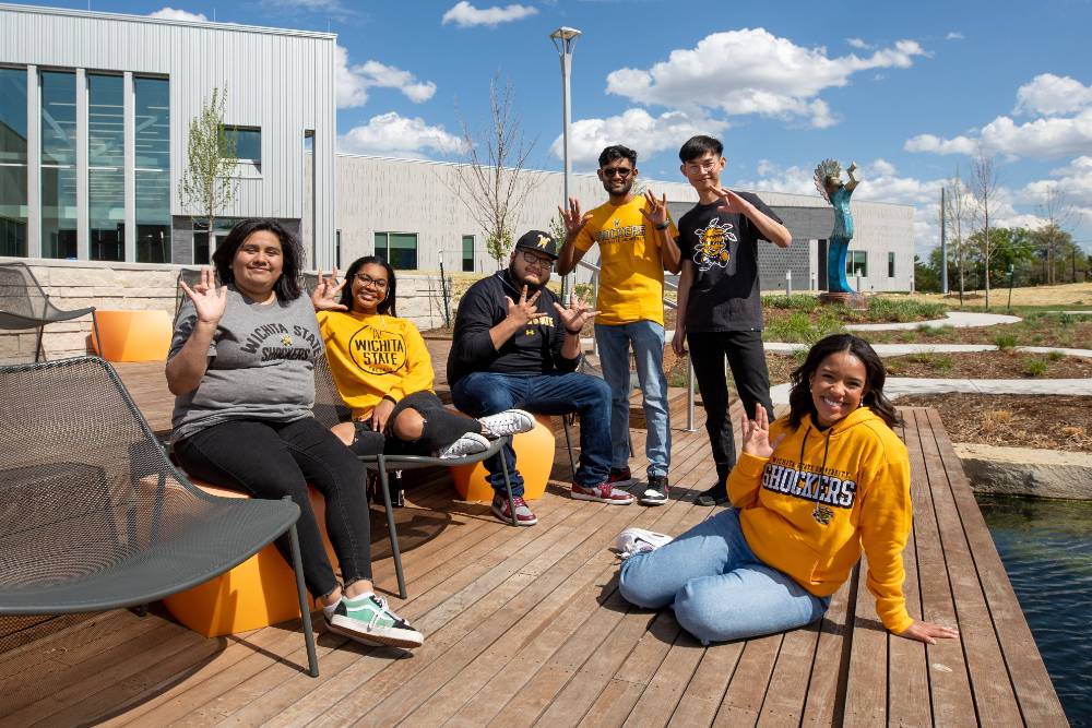 Students smiling on campus.