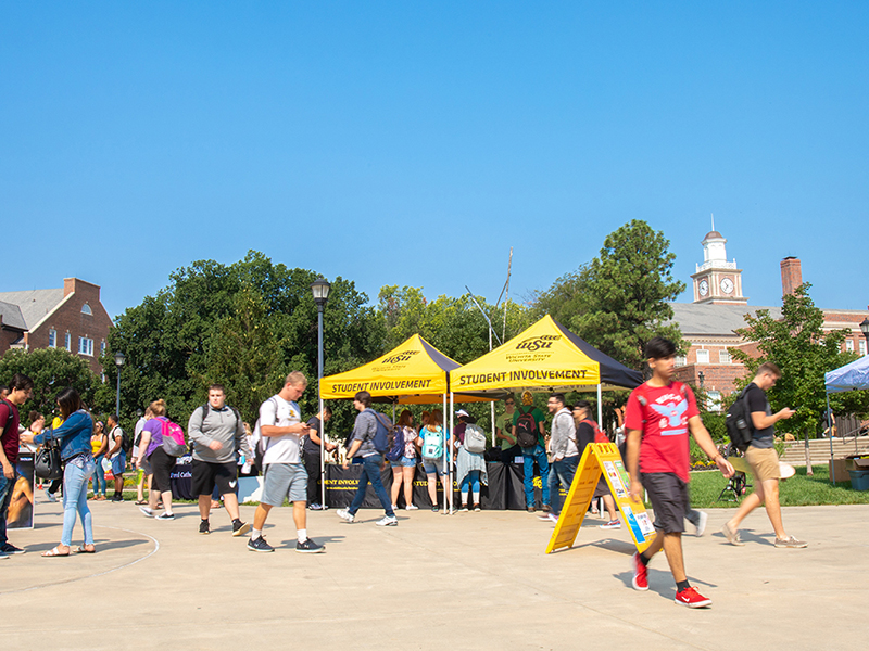 Welcome fair tables outside the Rhatigan Student Ceter