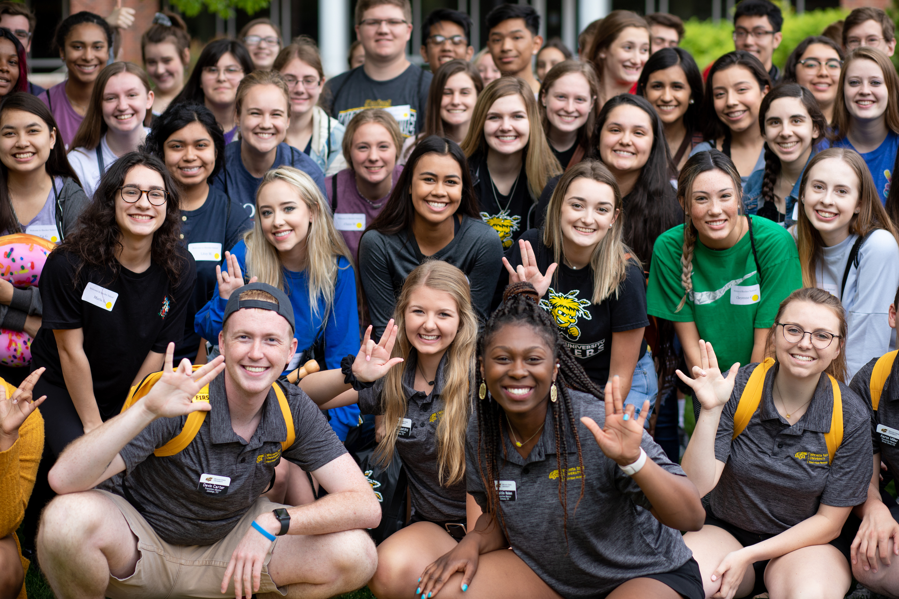 Photo of a large group of smiling students on Orientation Day 2019. 