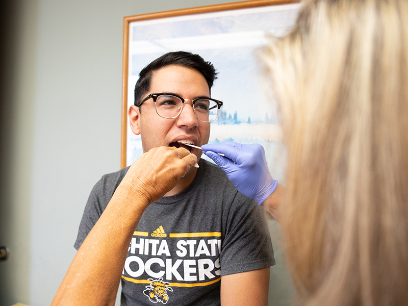 A student undergoes an exam at Student Health Services