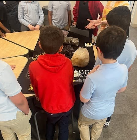 students looking at rocks from geology