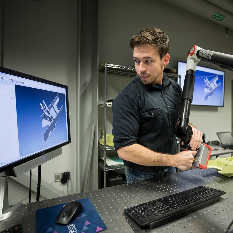 An Engineering student manipulates a 3D rendering