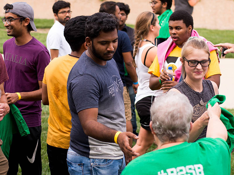 Students gather at an outdoor event.