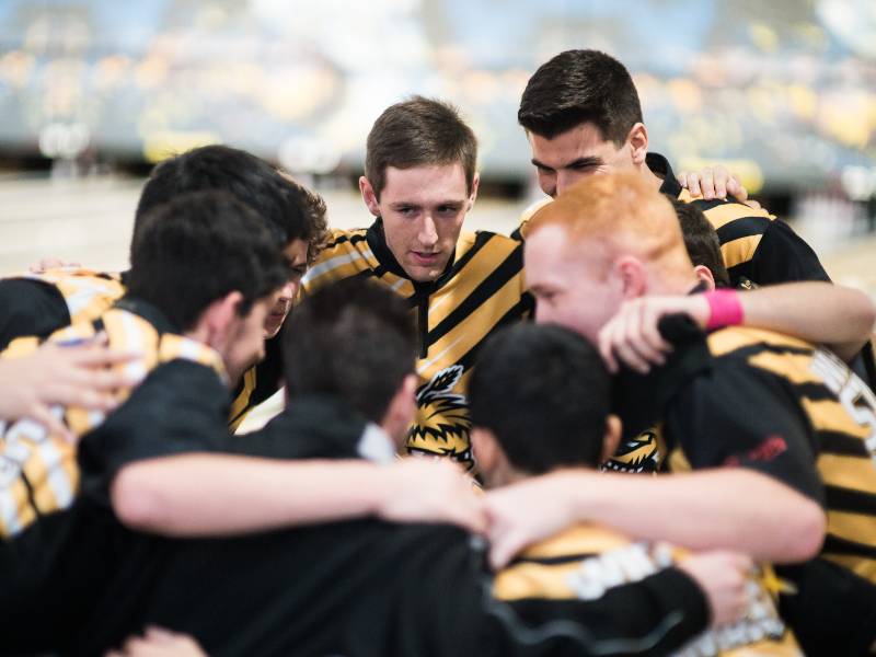 Shocker bowling team in huddle.