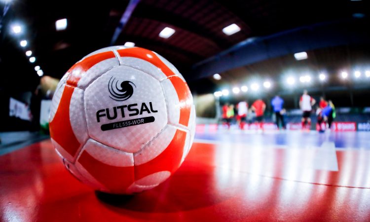 Orange Futsal ball on court