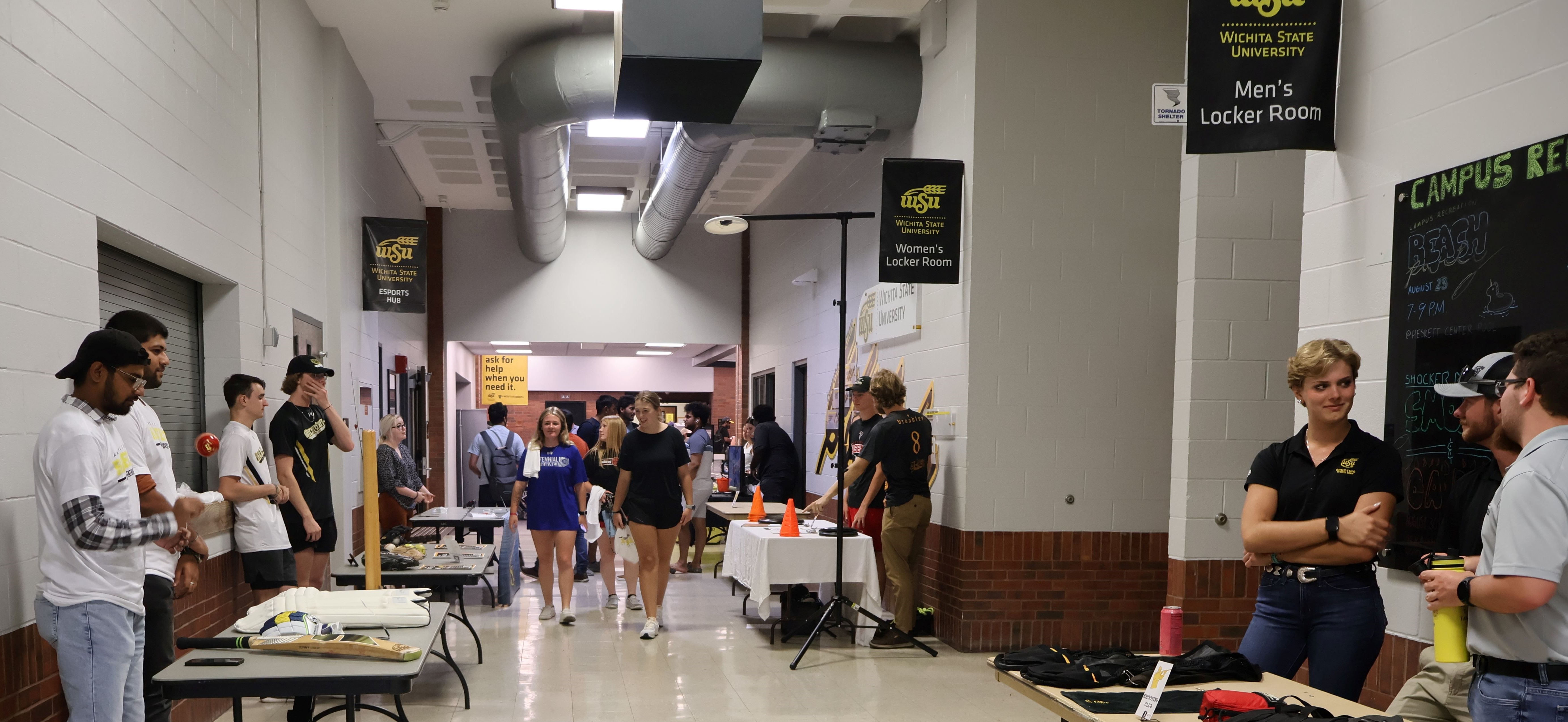 Students standing at rec fest booths