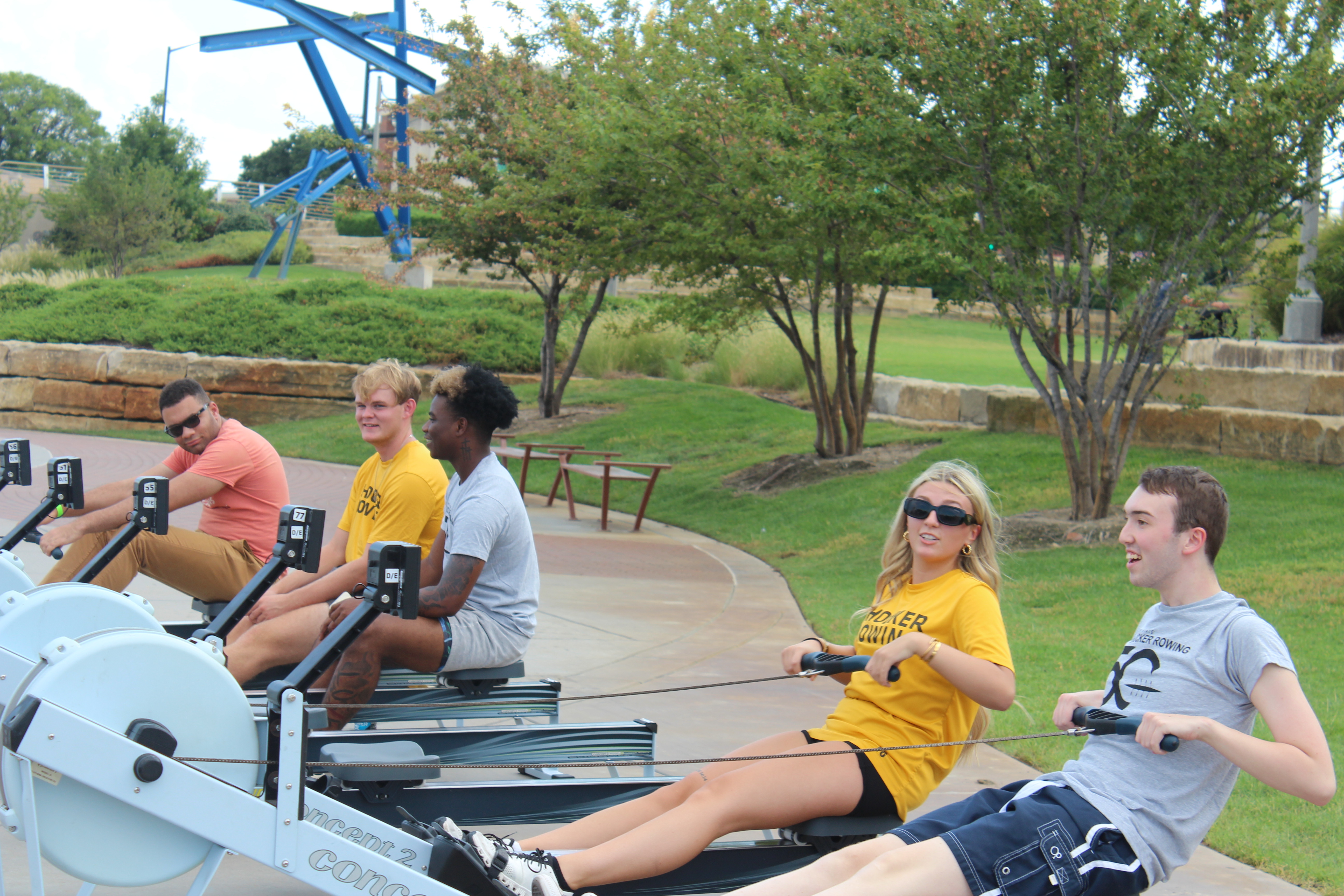 students on the erg machines