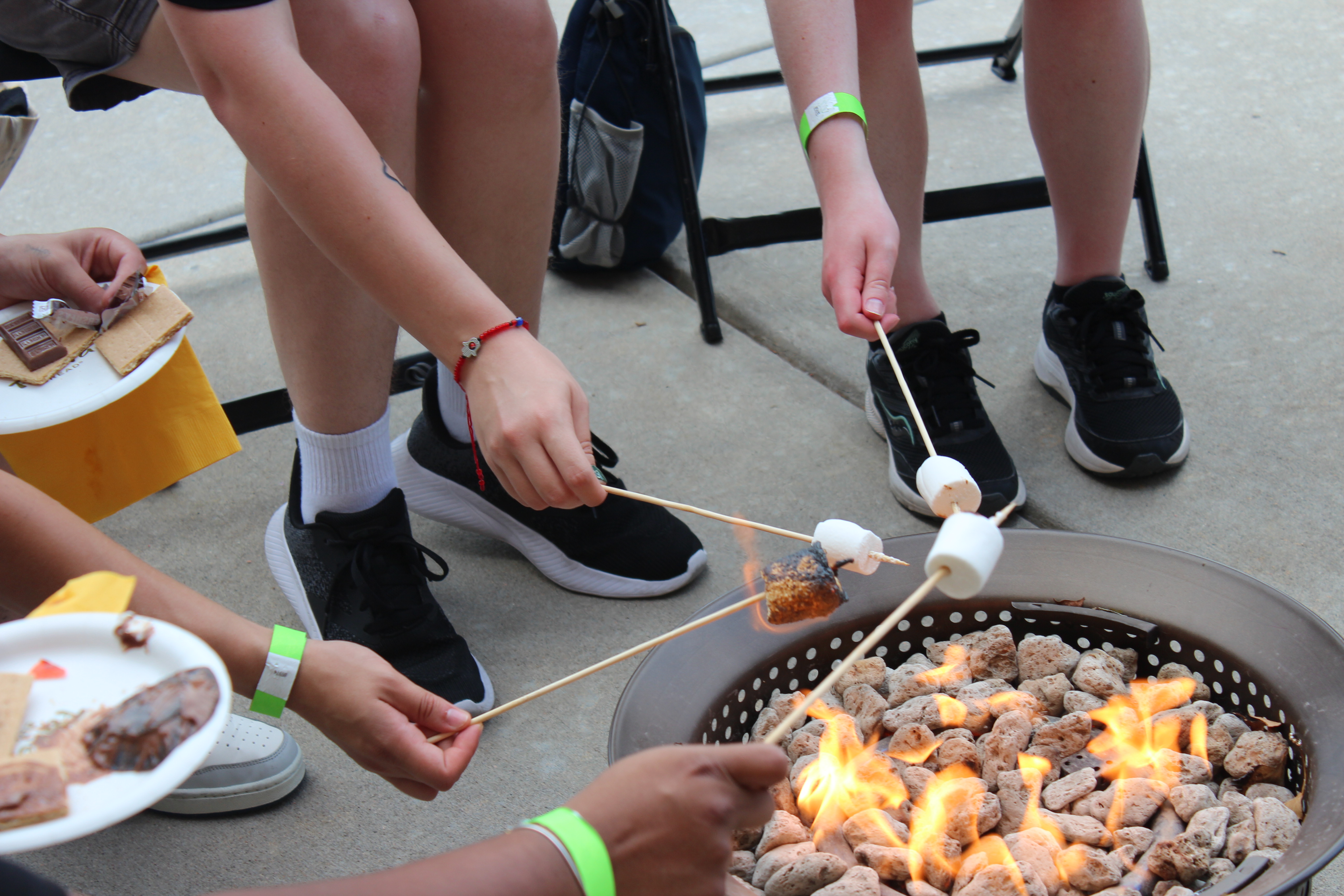 students roasting marshmallows