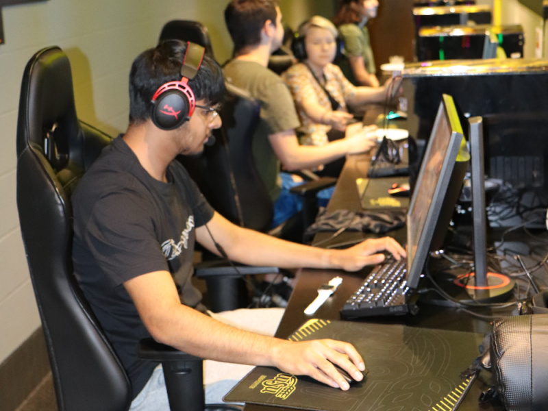 Student using a computer in the Esports Hub