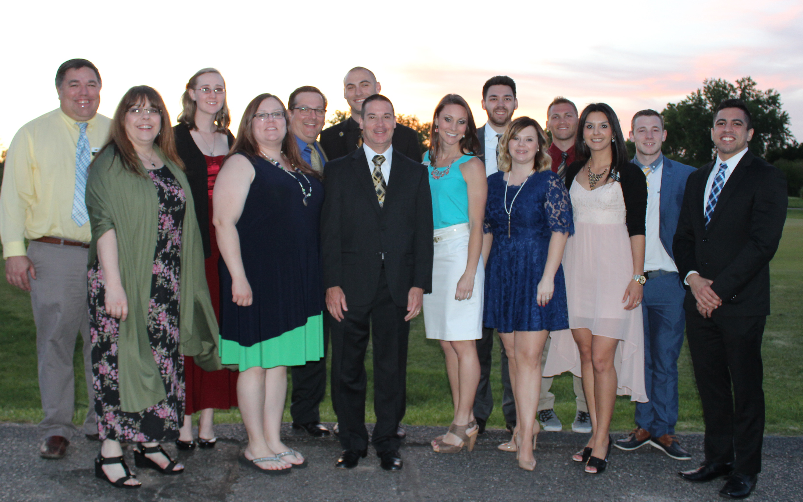 Thirteen members of faculty and staff