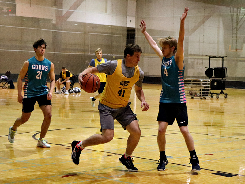 Men playing basketball