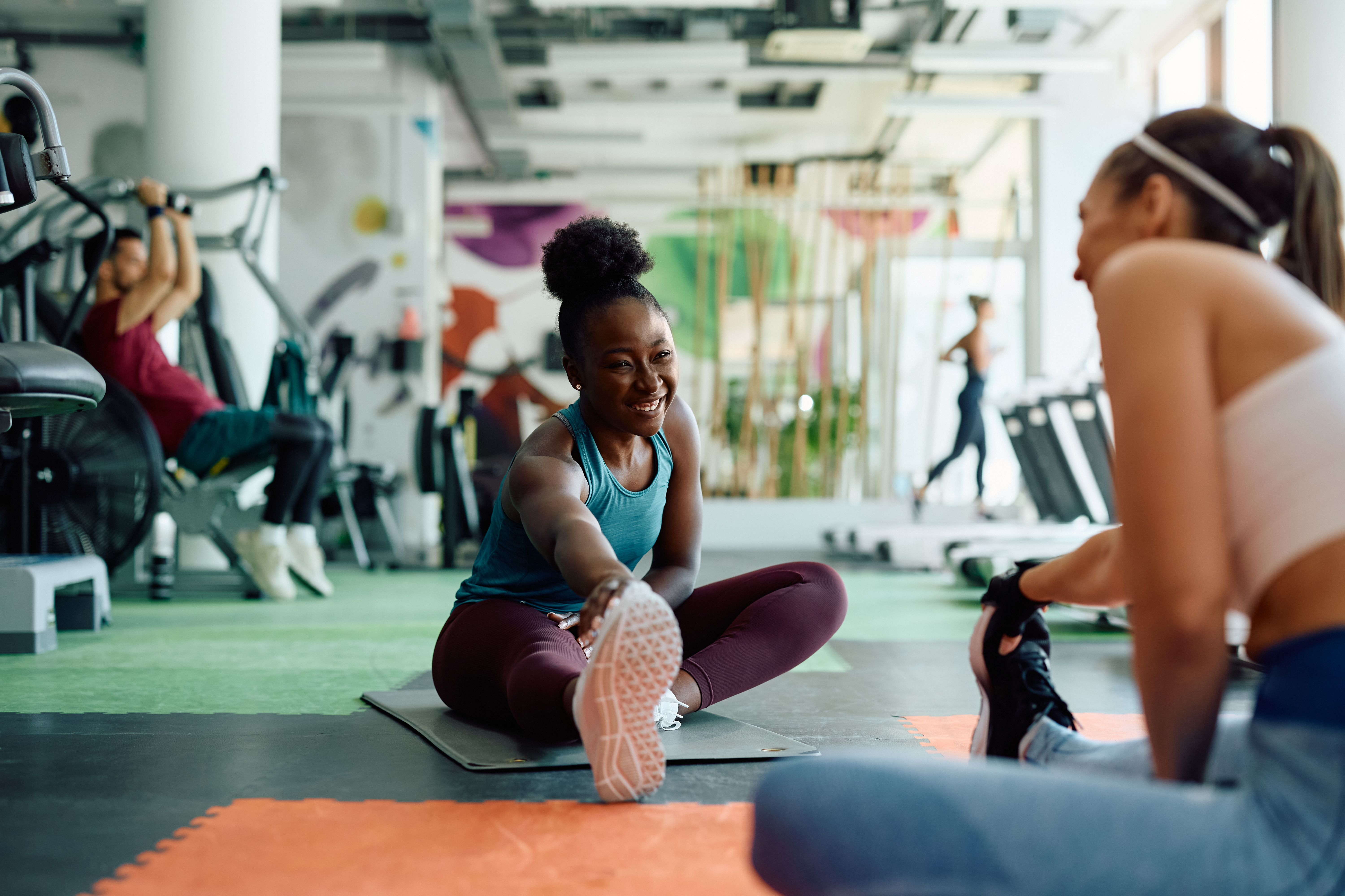 Two women stretching