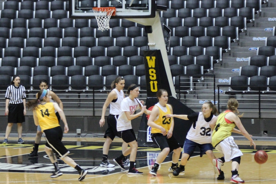 Women play intramural basketball