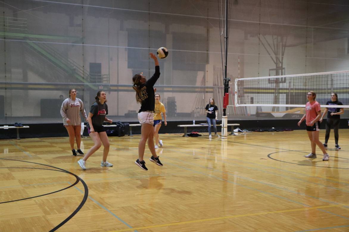 Women playing volleyball