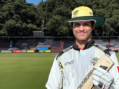 Avancha Kaushik smiles at the camera in his WSU cricket gear.