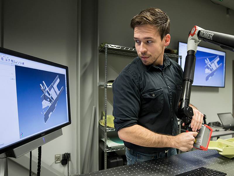 An Engineering student manipulates a 3D rendering