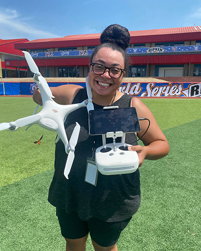 Amaya Harris holds a drone